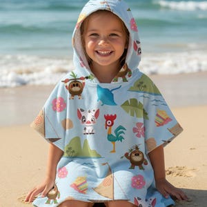 May include: A light blue hooded poncho towel featuring a repeating pattern of tropical island elements including a small pig, a rooster, sailboats, palm leaves, pink hibiscus flowers, and small brown creatures, with a white interior lining.
