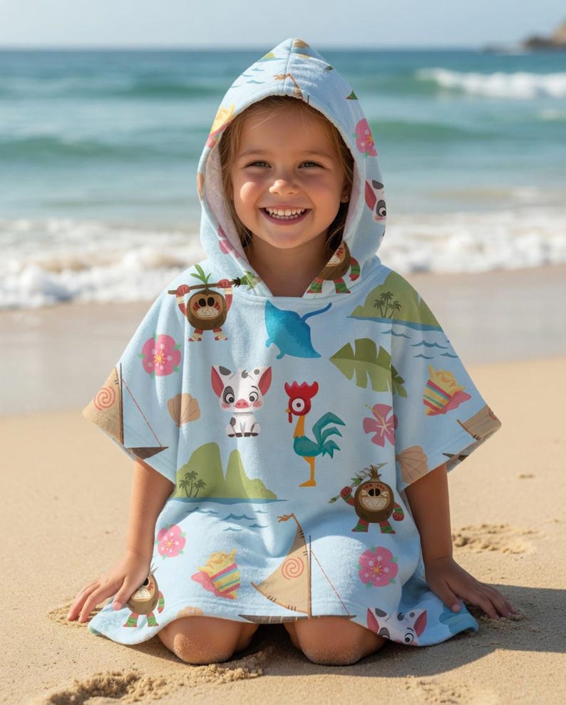 May include: A light blue hooded poncho towel featuring a repeating pattern of tropical island elements including a small pig, a rooster, sailboats, palm leaves, pink hibiscus flowers, and small brown creatures, with a white interior lining.