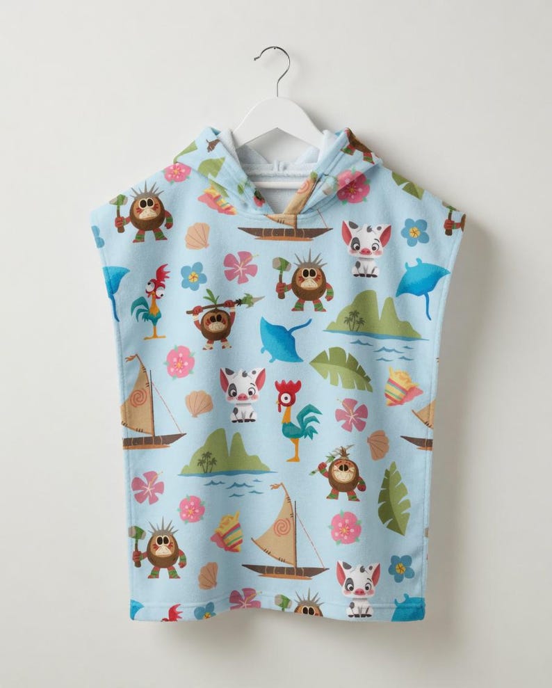 May include: A light blue hooded towel poncho featuring a repeating pattern of cartoon characters, including small brown creatures with spears, a white pig, a rooster, sailboats, tropical islands, blue stingrays, seashells, and pink flowers.
