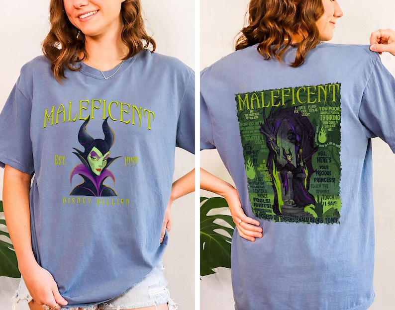 May include: A pale blue t-shirt with the word "Maleficent" in green, and an image of the character. The front of the shirt has the text "Est. 1959 Disney Villains". The back of the shirt has a graphic of Maleficent with text.