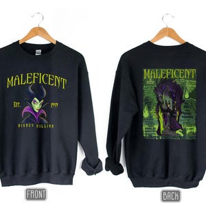 May include: Black sweatshirt with a graphic of Maleficent, a Disney villain, and the text "MALEFICENT" and "EST. 1959 DISNEY VILLAIN". The back of the sweatshirt has a green and black graphic of Maleficent.