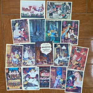 May include: A collection of vintage postcards featuring illustrations from a children's book, with a central book titled "Щелкунчик и Мышиный Король". The postcards depict colorful scenes with characters in period clothing, set against various backgrounds.