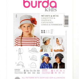 May include: A Burda Kids sewing pattern envelope, number 9496, for various caps and hats. The cover displays five different headwear styles labeled A through E, with head circumference measurements ranging from 15 to 21.25 inches printed below.