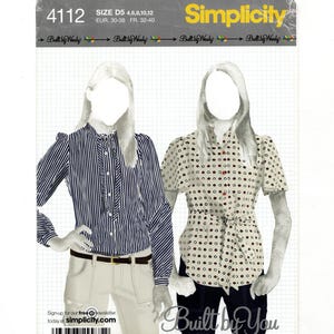 May include: Simplicity sewing pattern 4112 featuring two blouse designs. One blouse is striped with a tie neck, the other is dotted with a waist tie. The pattern includes sizes 4, 6, 8, 10, and 12. The text "Built by You" is also visible.