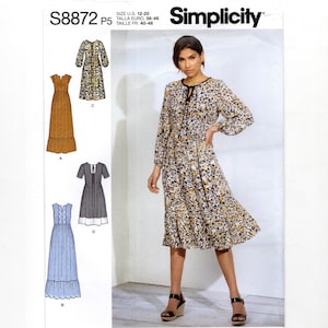 May include: Simplicity sewing pattern S8872 P5 featuring a woman wearing a floral print dress. The pattern includes multiple dress designs, with size information in US and Euro sizes. The Simplicity logo and "Since 1927" text are visible.