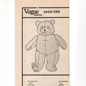 May include: A vintage Vogue Patterns sewing pattern featuring a teddy bear design. The pattern number is 8658/569. The illustration shows a detailed outline of the bear with its arms and legs extended. The bear has a smiling face and is ready to be sewn.