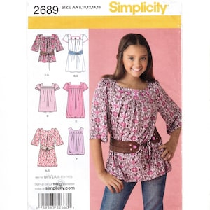 May include: Simplicity sewing pattern 2689 for sizes AA 8, 10, 12, 14, 16. The envelope features illustrations of various tunic and dress designs with square necklines and gathered details, alongside a photo of a patterned tunic top.