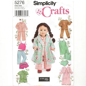 May include: Simplicity Crafts sewing pattern for doll clothes. The pattern includes pajamas, a robe, a dress, and other outfits. The doll in the image is wearing a pink and green outfit. The pattern is one size.