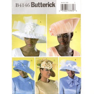 May include: Butterick B4146 sewing pattern envelope featuring five distinct hat designs. The hats include a white wide-brimmed hat with a large bow, a peach-colored angled hat with floral accents, a blue hat with a side bow, a tan hat with fabric roses, and a light blue hat with white ribbon trim.