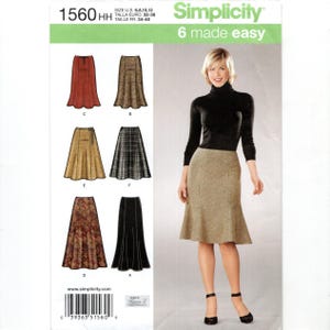 May include: Simplicity sewing pattern 1560 for a skirt with six variations. The envelope displays the pattern number 1560 HH, size range 6-12, and the text 6 made easy. Illustrations show various skirt styles in solid, plaid, and floral fabrics.