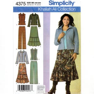 May include: Simplicity sewing pattern 4375 from the Khaliah Ali Collection, size BB 20W-28W. The envelope displays illustrations of a jacket, vest, trousers, and tiered skirt in various colors and patterns, alongside a photograph of the finished garments.