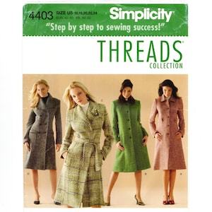 May include: A Simplicity 4403 sewing pattern envelope for the Threads Collection featuring four knee-length coats. The designs include a grey tweed double-breasted coat, a plaid belted coat, a solid green coat, and a solid mauve coat with buttons.