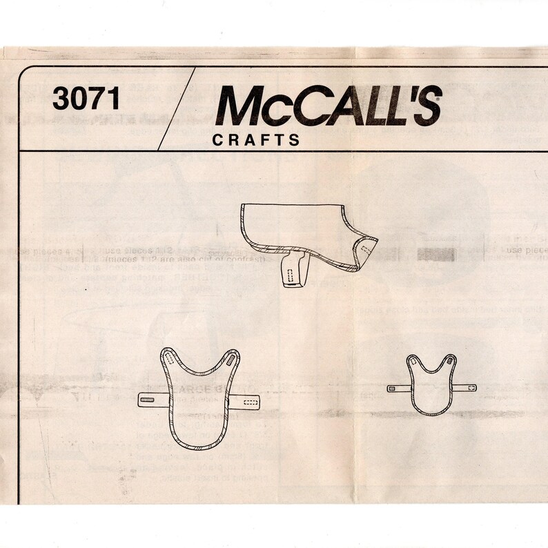 May include: A vintage McCall's Crafts sewing pattern, number 3071, featuring line drawings of a dog coat and saddle. The pattern includes various sizes and design elements, printed on aged paper.