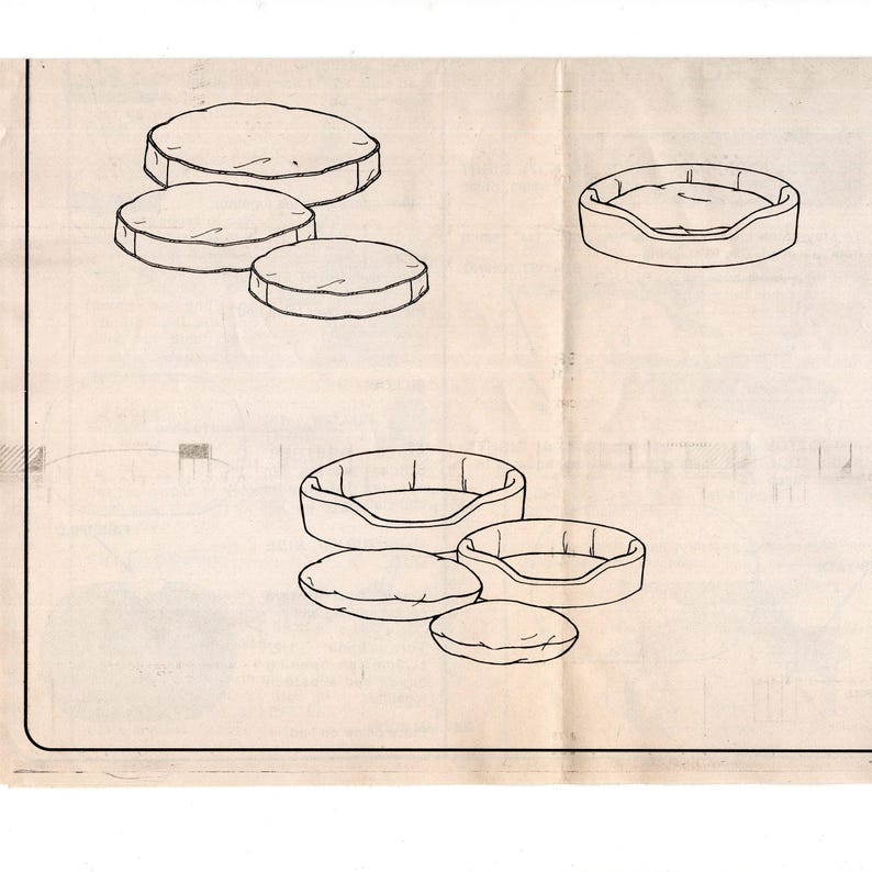 May include: Line drawing of pet beds and cushions. The image shows several variations of round pet beds with raised sides and matching round cushions. The beds and cushions are in different sizes, suggesting a pattern or design for pet accessories.