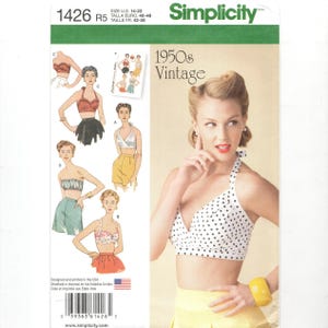 May include: Simplicity sewing pattern 1426 R5 for a 1950s vintage halter top with polka dots. The pattern includes four different styles of tops. The pattern is designed and printed in the USA.