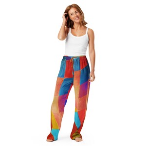 May include: Pajama trousers featuring a vibrant geometric design in red, blue, yellow, and orange. The trousers have a drawstring waist and a loose fit. The pajama trousers are made from a soft, comfortable fabric.