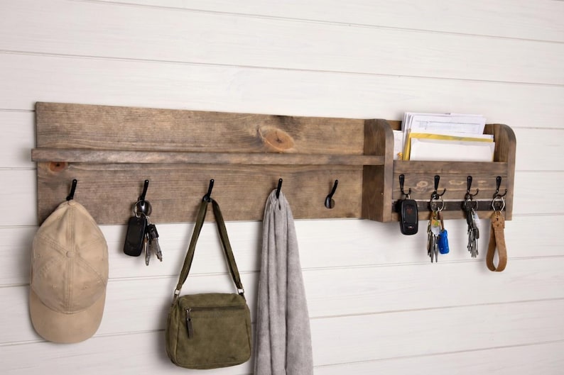 Entryway organizer holding a cap, purse and scarf