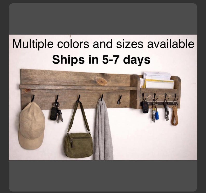 Wooden entryway organizer with coat hooks, shelf, mail slot and key hooks