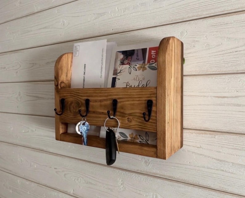 Wooden mail organizer with mail slot and four black key hooks