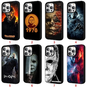 May include: Eight black phone cases showcasing different images of Michael Myers from the Halloween horror film series. The designs include portraits, stills, and the film's title.