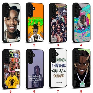May include: Collection of eight black phone cases with various designs. The designs include portraits, text, and graphic illustrations. The cases feature images of a smiling person, text that says "223'5", and a collage of images.