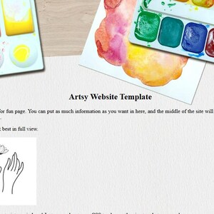 May include: Overhead view of art supplies: watercolour palettes with assorted colours, paintbrushes, and a paper with the text "Artsy Website Template" and a line drawing of hands holding a flower.