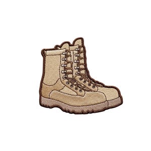 May include: Embroidered patch featuring a pair of tan combat boots. The boots have brown laces, eyelets, and a brown border. The patch is designed to be sewn or ironed onto fabric, showcasing a detailed, realistic design.