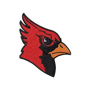 May include: Embroidered patch featuring a red cardinal bird head with black and orange accents. The cardinal has a stern expression, with a detailed eye and beak. The patch is likely for apparel or accessories.