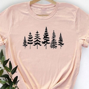 May include: A set of three ceramic mugs with a speckled, matte finish. The mugs are in shades of cream, light gray, and dark gray. Each mug has a simple, minimalist design, perfect for coffee or tea.