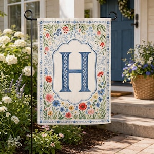 May include: A set of three ceramic mugs with a speckled, matte finish in cream, light grey, and dark grey. Each mug has a simple, minimalist design, ideal for coffee or tea.