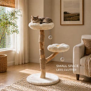 May include: A beige cat tree with two platforms and a base, topped with a fluffy white cushion. A gray tabby cat rests on the top platform. The text "SMALL SPACE LESS CLUTTER" is visible.