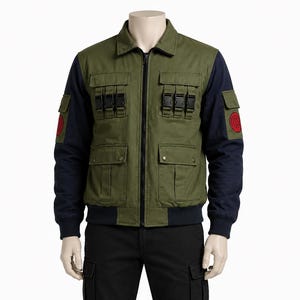 May include: Olive green jacket with navy blue sleeves and a black zip. The jacket features multiple pockets with black buckles and a red emblem on the left sleeve. The jacket is displayed on a mannequin.
