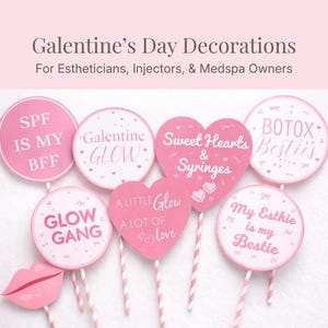 May include: A selection of pink Galentine's Day decorations, including heart and circular shapes with text such as "Glow Gang" and "Sweet Hearts & Syringes." The decorations are on sticks and are aimed at estheticians and medspa owners.