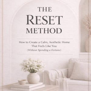 May include: A book cover with the title "THE RESET METHOD" in large, bold letters. The subtitle reads "How to Create a Calm, Aesthetic Home That Feels Like You (Without Spending a Fortune)". The cover features a soft, neutral color palette with a vase of white flowers.