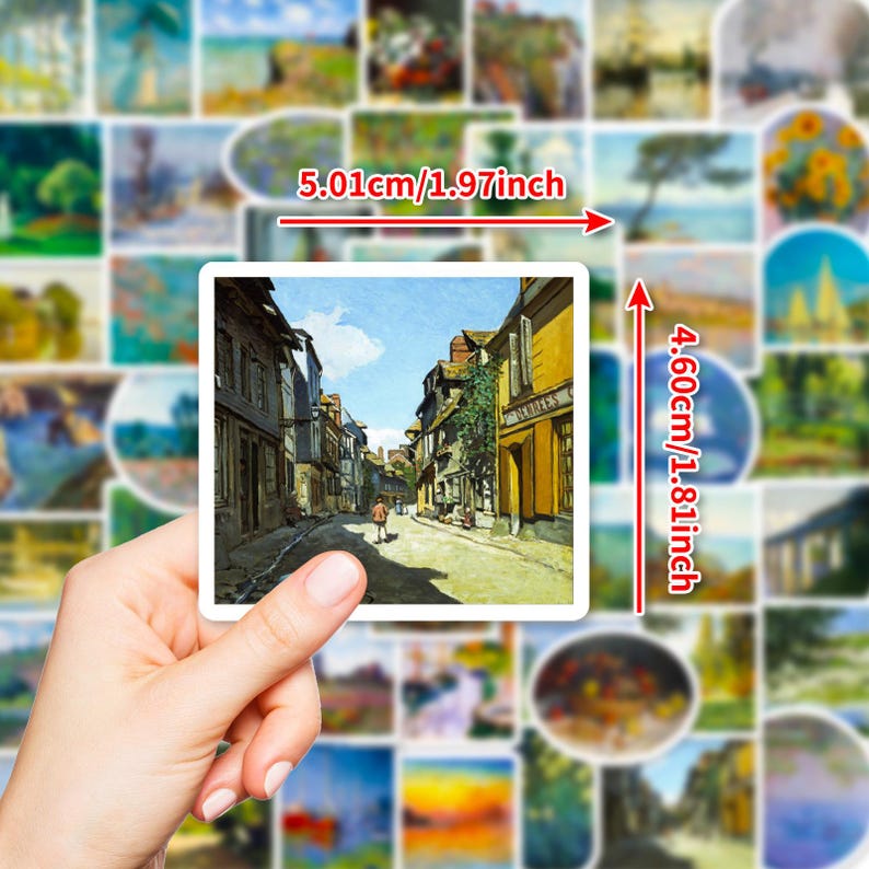May include: A hand holds a square sticker with a street scene painting, measuring 1.97 inches wide and 1.81 inches tall. The sticker is surrounded by other stickers with landscape art. The street scene features buildings and a person walking.