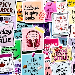 May include: A selection of vibrant stickers with diverse text and illustrations. The stickers display phrases such as "Addicted to spicy books," "Romance Reader," and "Read more smut." Other stickers feature headphones, books, and coffee cups.