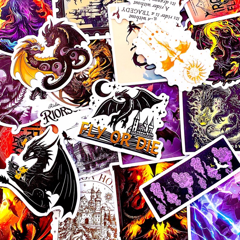 May include: A collection of fantasy-themed stickers featuring dragons, castles, and celestial elements. The stickers showcase various dragon designs in black, gold, and purple, with phrases like "Fly or Die". The overall aesthetic is dark and mystical.