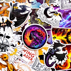 May include: A collection of fantasy-themed stickers featuring dragons, moons, and mystical imagery. The stickers showcase a variety of colors, including black, purple, orange, and yellow. One sticker has the text "WING READER".