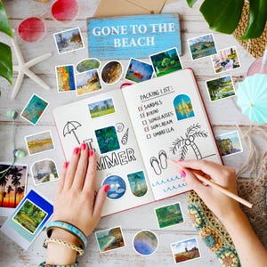 May include: A notebook with a packing list and the words "I SUMMER" is surrounded by stickers of paintings, sunglasses, and a sign that says "GONE TO THE BEACH". A person is writing in the notebook with a pencil. The scene is set on a wooden surface.