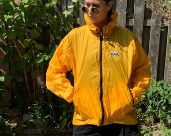 vintage 1990s Windbreaker Yellow Louis Garneau Packable Pouch Rain Jacket oversized sport athletic cycling wear Shell Layer
