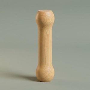 May include: A vertical, cylindrical wooden object with a smooth, light tan finish. The item features a rounded, bulbous shape at both the top and bottom ends, tapering into a narrower, straight central shaft with visible natural wood grain patterns.