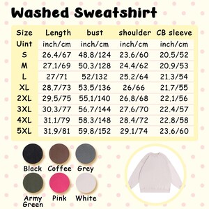 May include: A washed sweatshirt in various colors, including black, coffee, grey, army green, pink, and white. Size chart with measurements in inches and centimeters. The sweatshirt is shown in a light color.