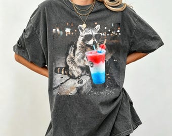 4th of July  Raccoon T-Shirt, Funny Summer Patriotic Critter Casual Graphic Tee, Red White Blue Popsicle Drink Shirt