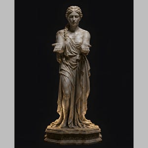 May include: A full-length off-white marble statue of a figure with braided hair, wearing a draped garment. The figure stands on an octagonal base with a Greek key pattern, extending both hands forward with palms open in a gesture of offering.