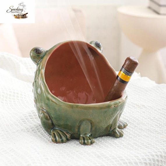 A hand-sculpted ceramic frog that doubles as a lidded trinket bowl — part amphibian art, part functional stash spot.