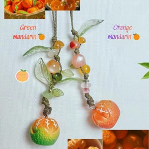 May include: Two mandarin orange-themed charms with beaded accents and glass leaves. One charm is green and orange, the other is orange. The image includes photos of mandarin oranges and the text "Green mandarin" and "Orange mandarin".