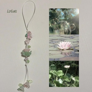 May include: A delicate floral charm with pink, green, and clear beads and flower accents. The word "Lotus" is written in cursive at the top left. The image also includes a collage of lotus flowers in a pond.