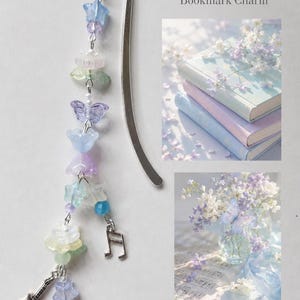 May include: A silver metal bookmark with a dangling charm chain featuring pastel-colored beads in shapes of stars, flowers, and a butterfly, along with small silver music note and guitar charms. The text reads Pastel Harmony Bookmark Charm.