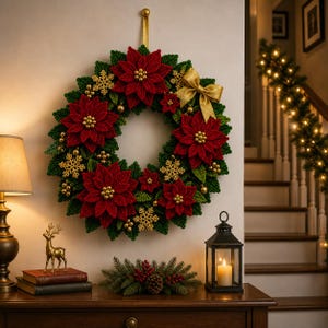 May include: A handmade Christmas wreath featuring red poinsettias, green leaves, and gold accents. The wreath is adorned with gold snowflakes and a gold bow. It is hanging on a wall, creating a festive holiday decoration.