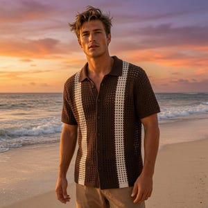 May include: A short-sleeved button-down shirt featuring a dark brown open-knit crochet texture with two vertical cream-colored stripes running down the front. The shirt has a classic collar and a buttoned placket, showcasing a semi-sheer construction.